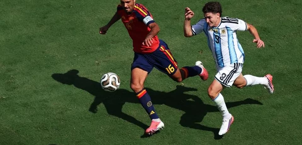 Two players competing for the ball in match