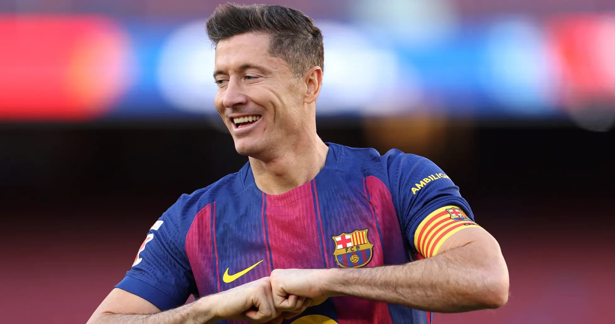 Player in Barcelona kit smiling on the pitch