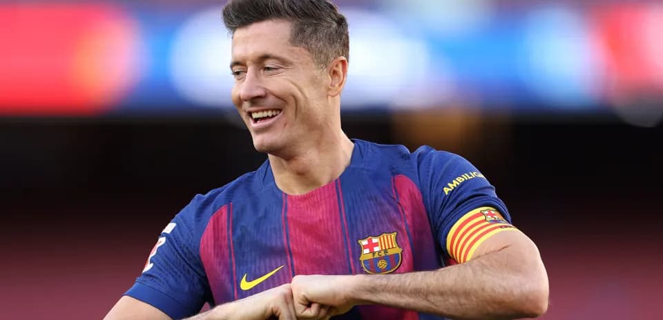 Player in Barcelona kit smiling on the pitch