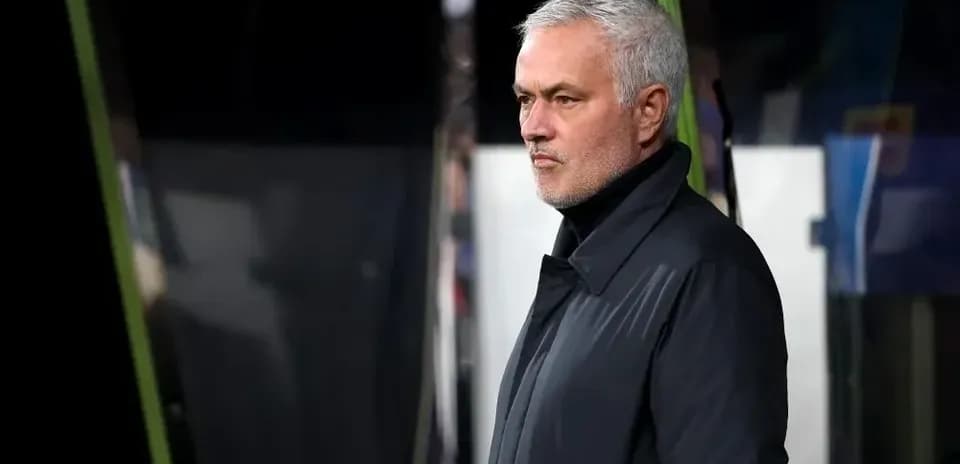 Manager observing from the sidelines during match
