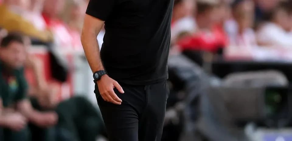 Manager giving instructions from the sidelines during match