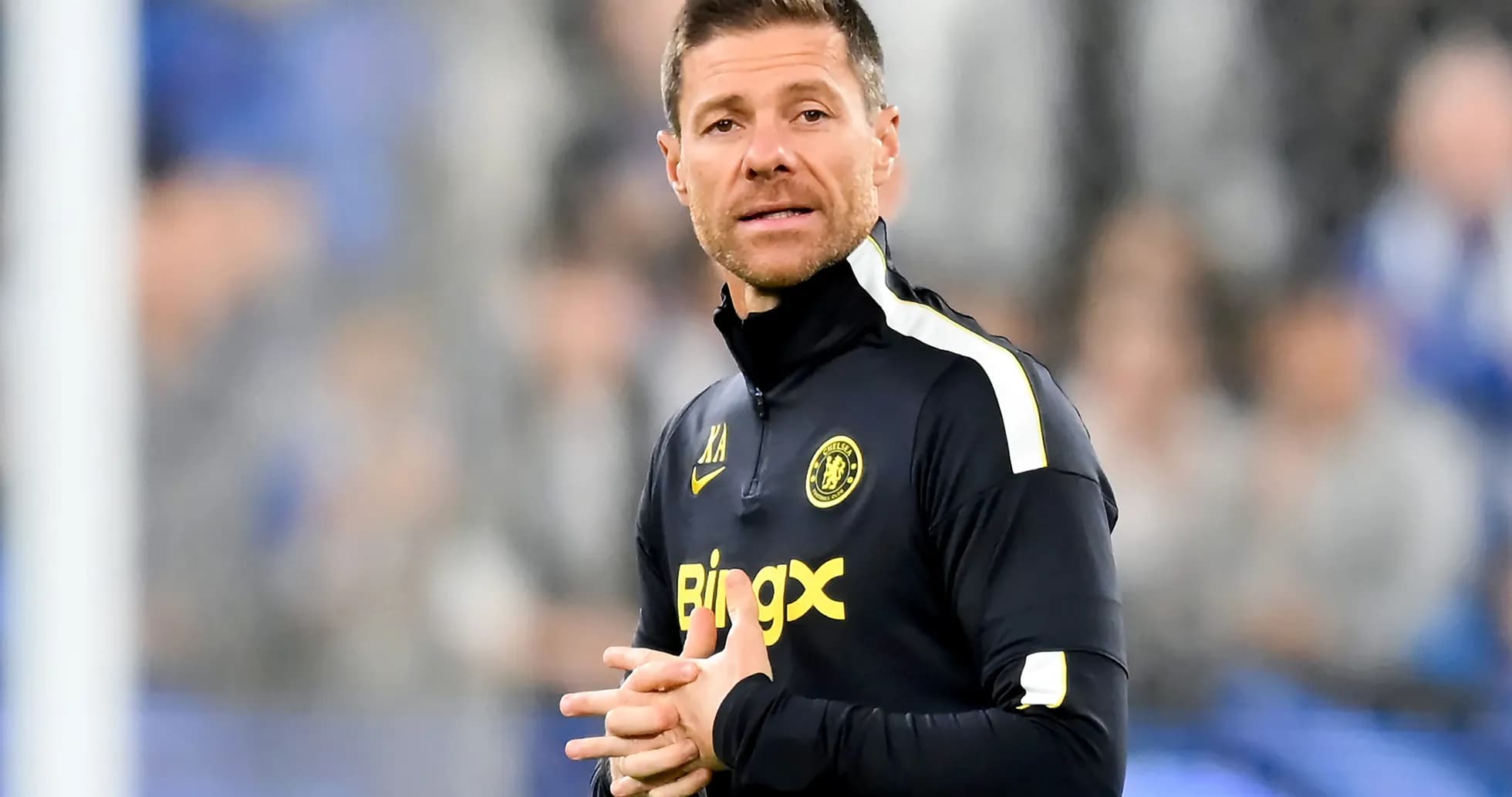 Coach giving instructions on the sidelines during match