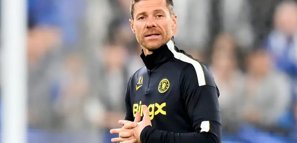 Coach giving instructions on the sidelines during match