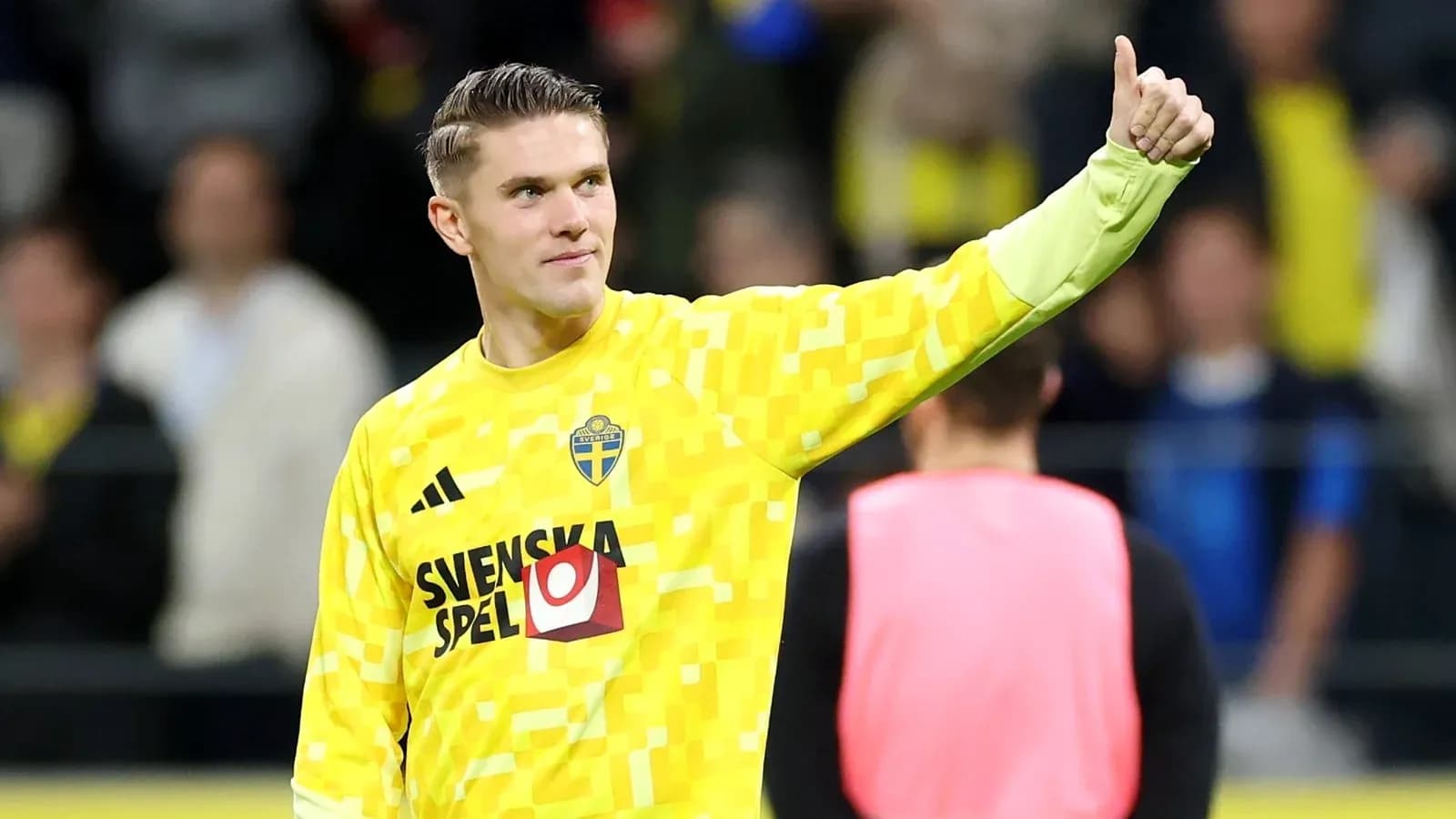 Goalkeeper gesturing positively after the match