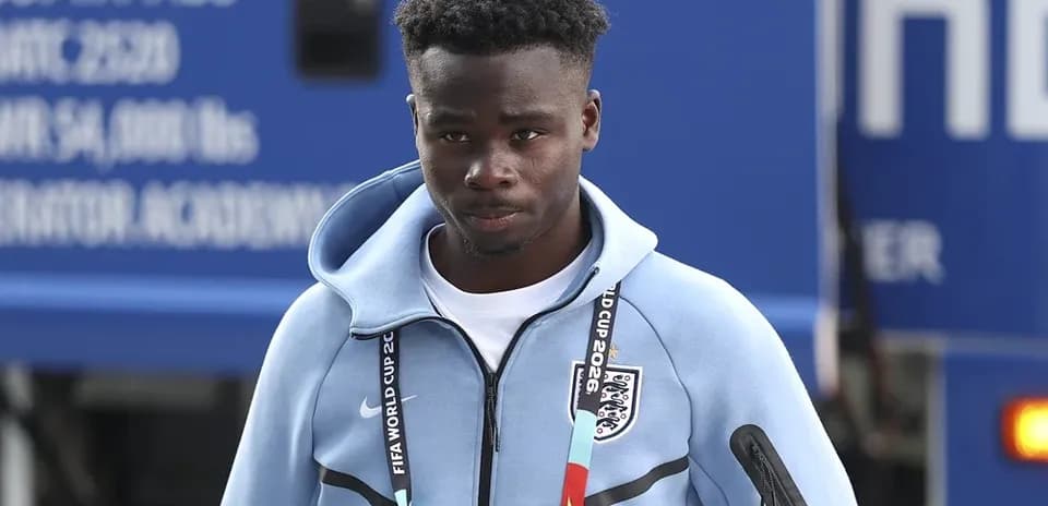 Player arriving at venue wearing team training gear