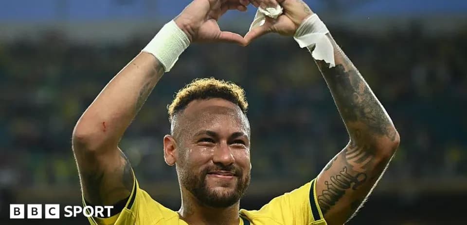 Neymar celebrating by forming a heart with hands