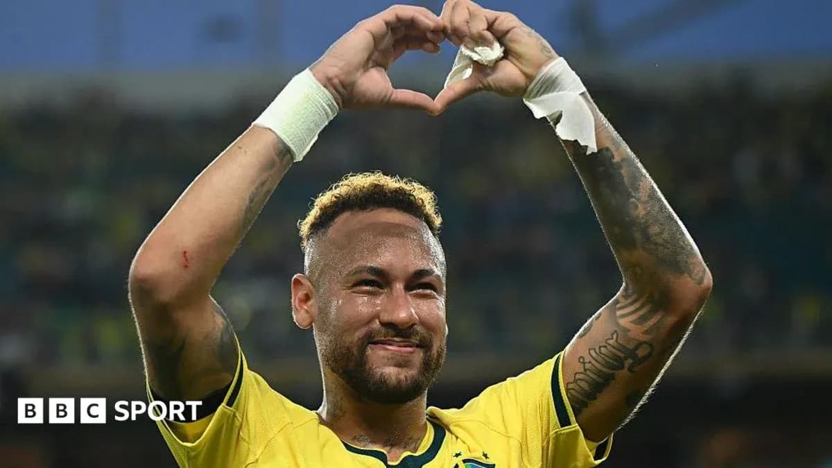Neymar celebrating by forming a heart with hands