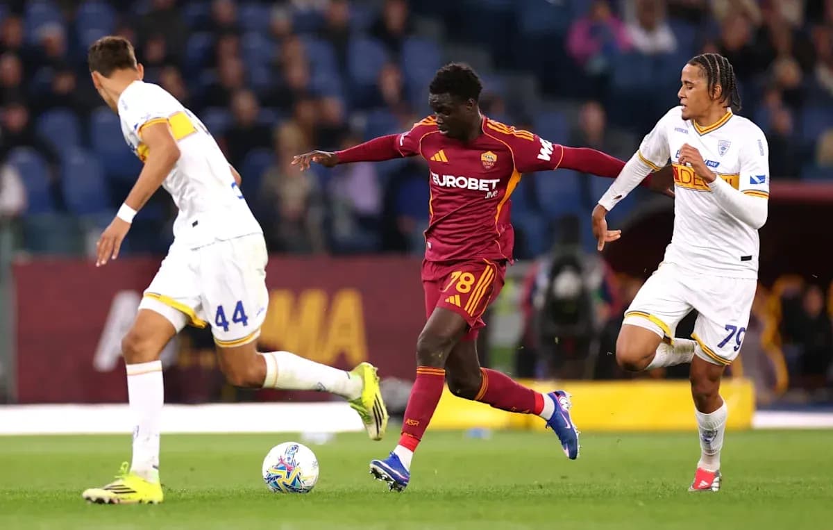 Player dribbling past two opponents during match