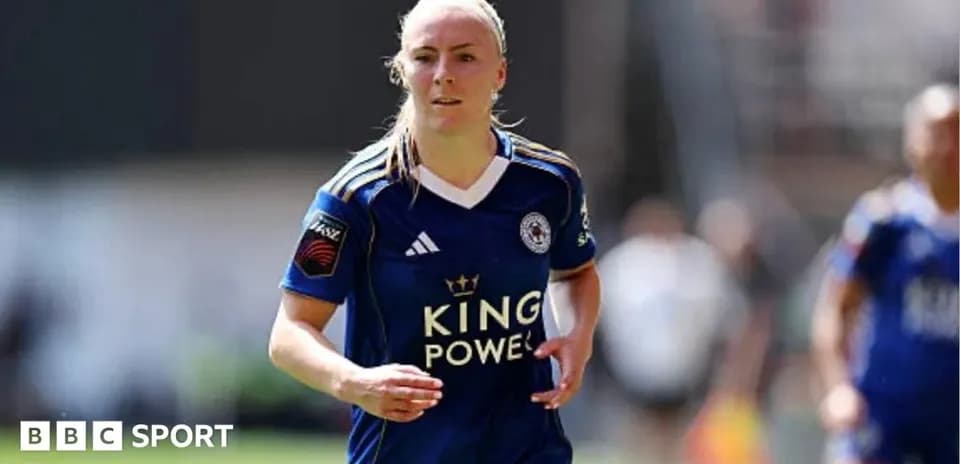 Player in blue jersey running on the field