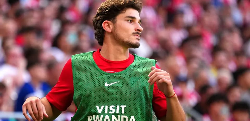 Player in training vest during match warm-up