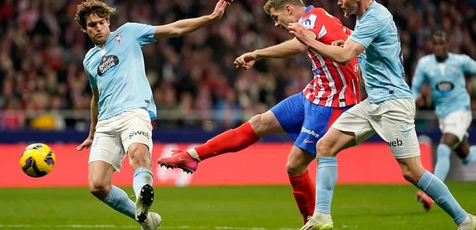 Atletico Madrid player kicking the ball