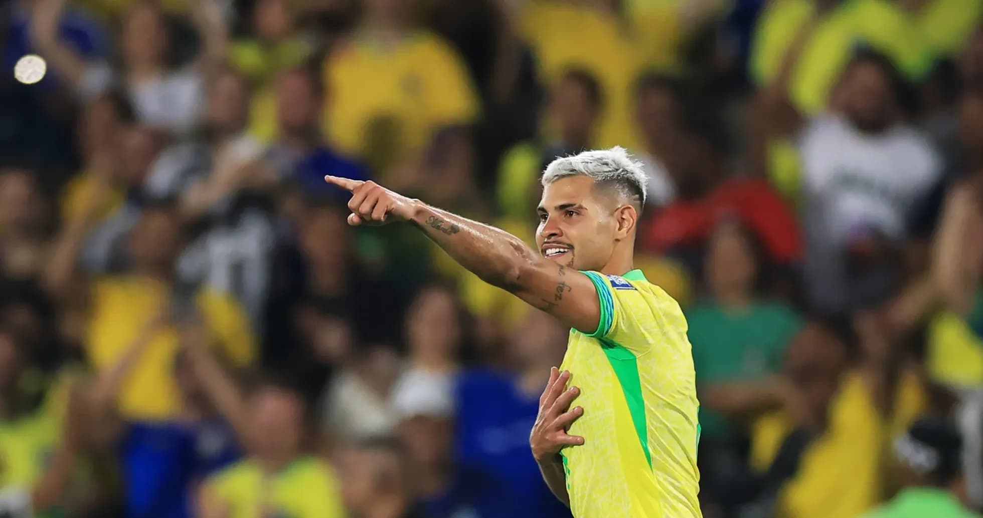 Player celebrating a goal with fans in background