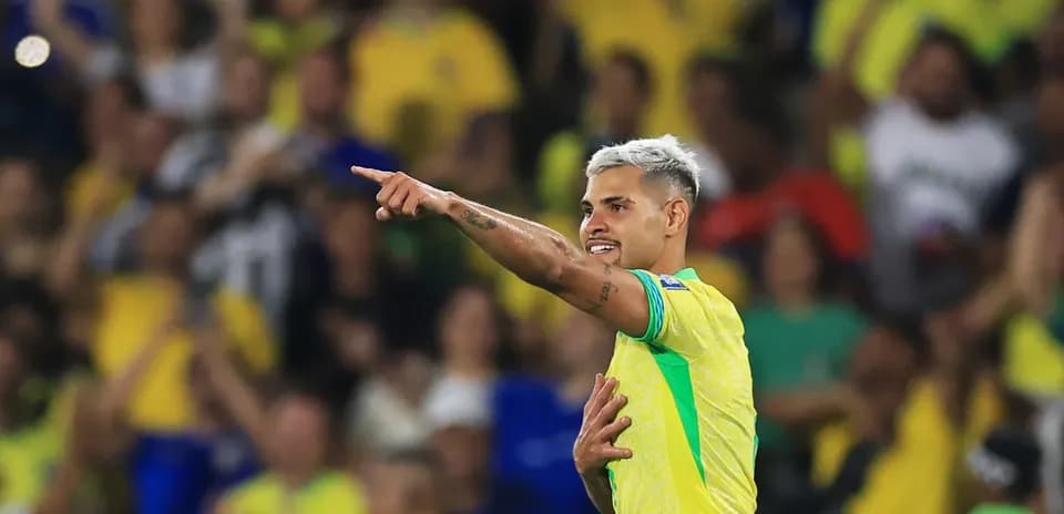 Player celebrating a goal with fans in background