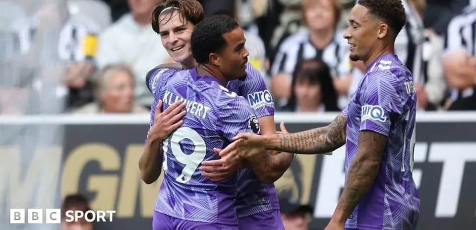 Players celebrating a goal during a match