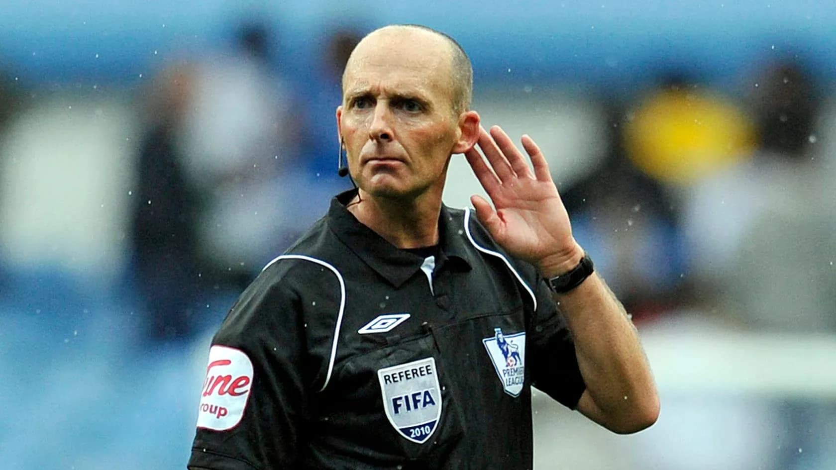 Referee signaling during a football match
