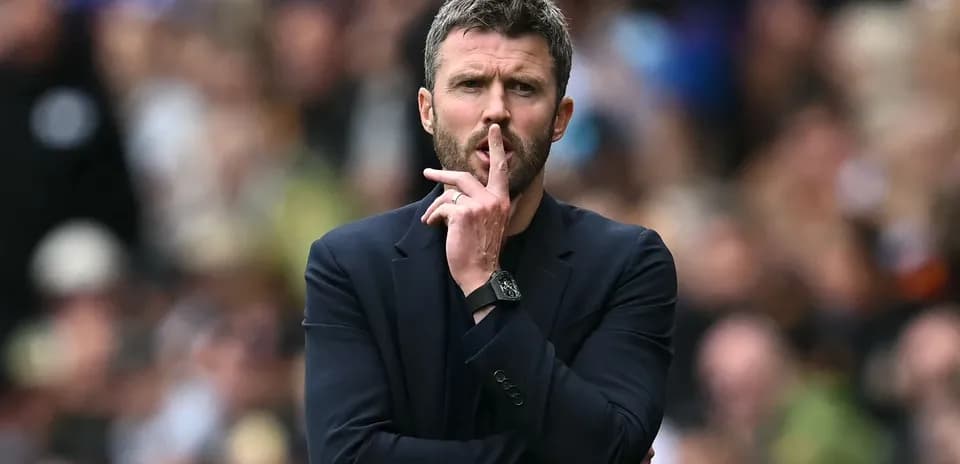 Coach gesturing for silence during match