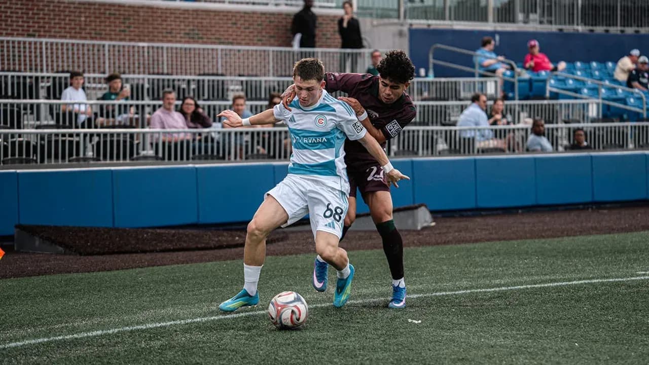Player battling for the ball during match