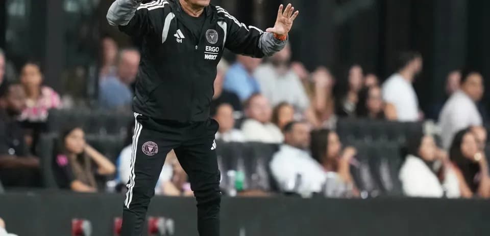 Coach directing players during a match from sidelines