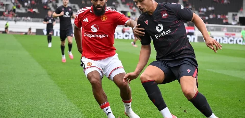 Two players contesting for the ball during match
