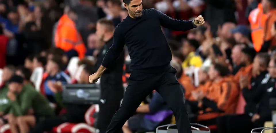 Manager celebrating on the sideline during match