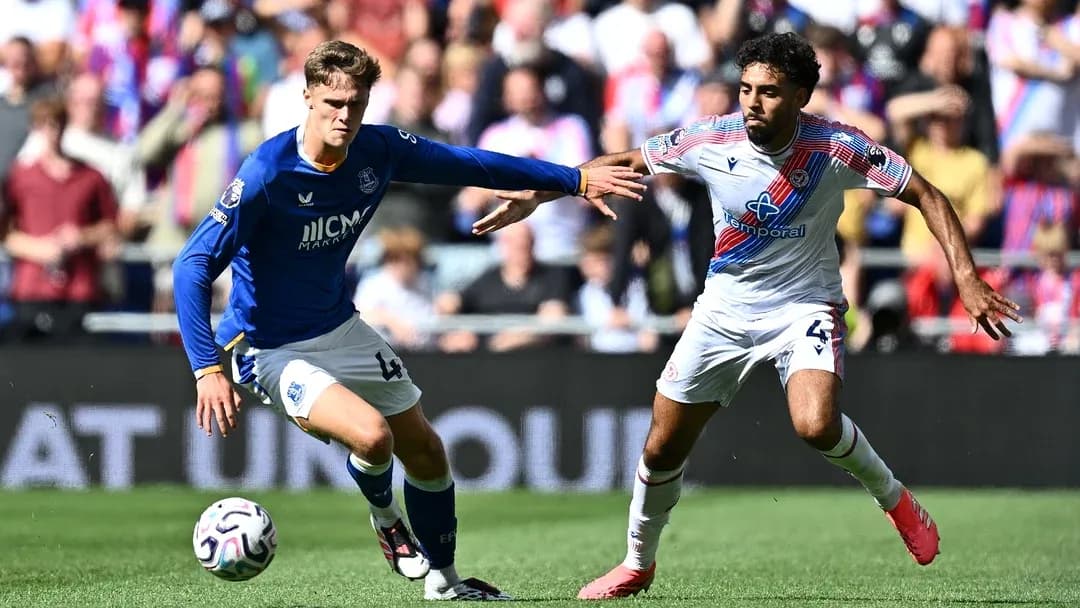 Two players contesting for the ball during match