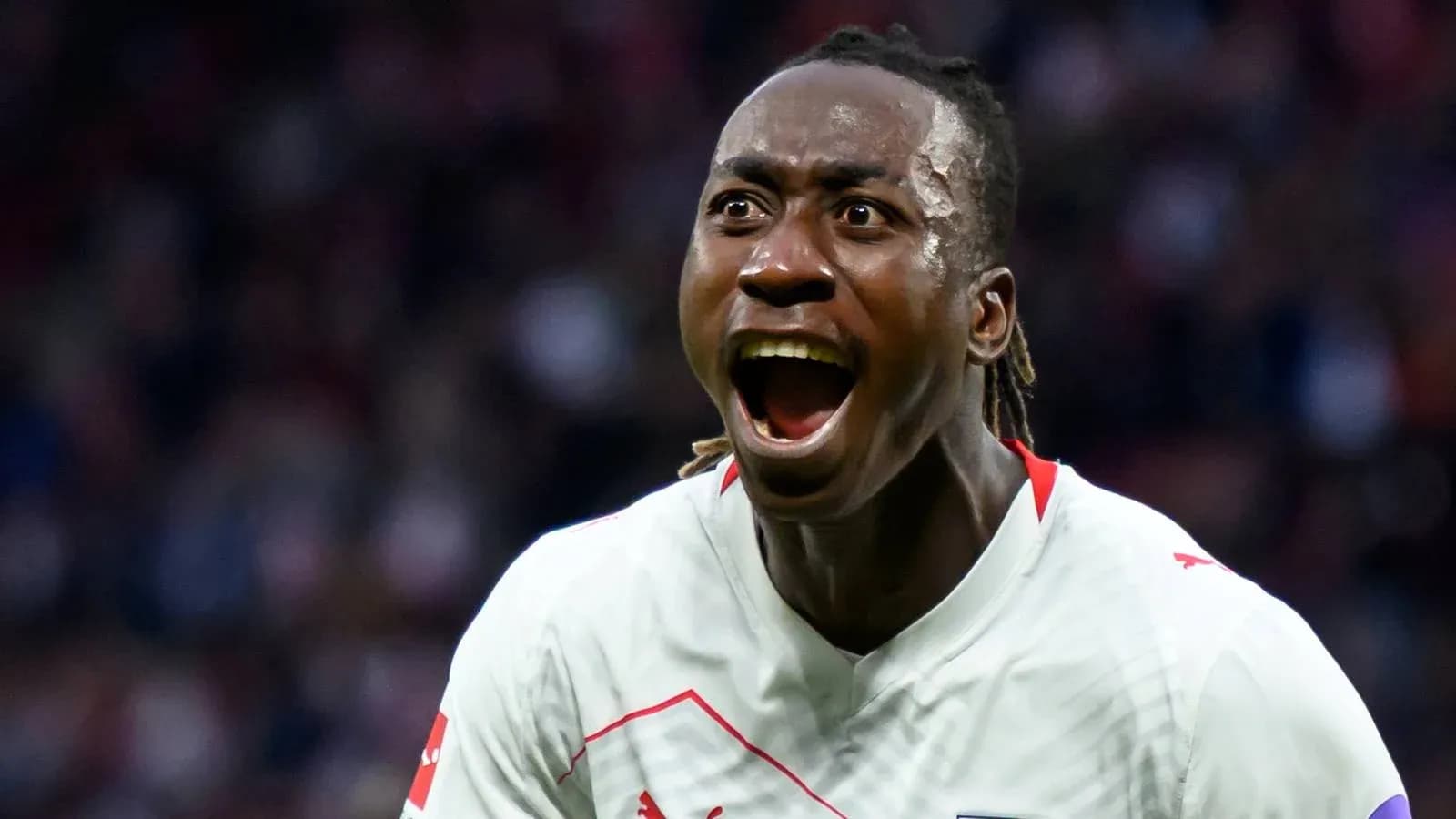 Player celebrating a goal with intense expression