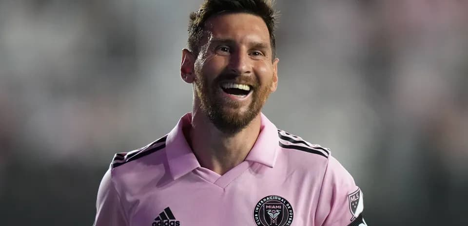 Player smiling in pink jersey during match