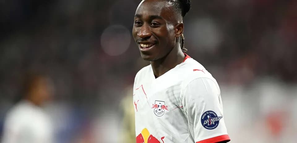 Player smiling in RB Leipzig match uniform
