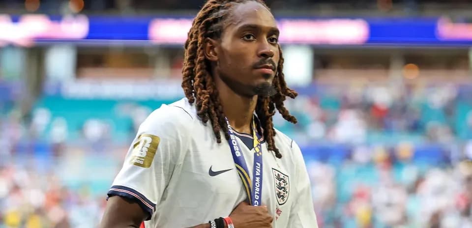 Player wearing England jersey walking after match