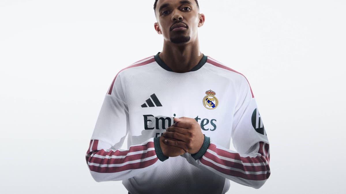 Player posing in Real Madrid home jersey