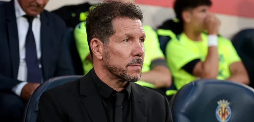 Coach sitting on the bench during a match