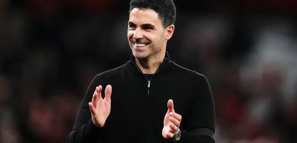 Manager applauding during a match at the stadium