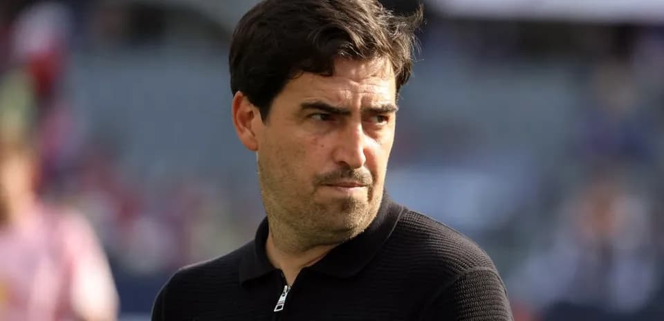Coach observing match from the sidelines
