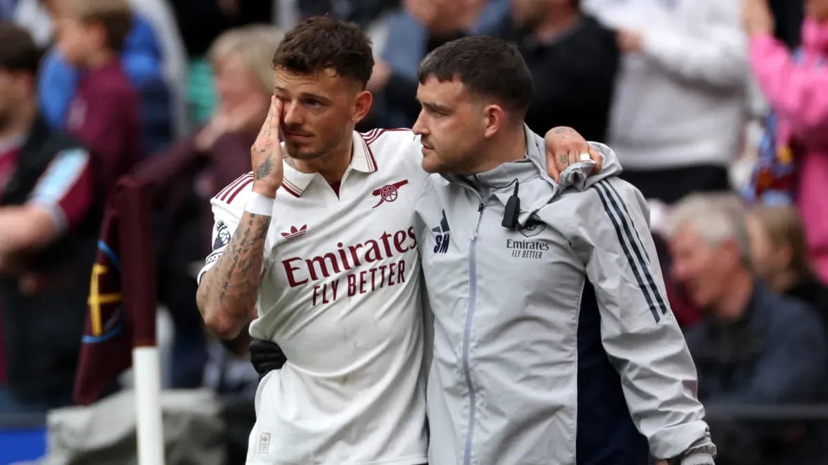 Player being assisted off the field after match