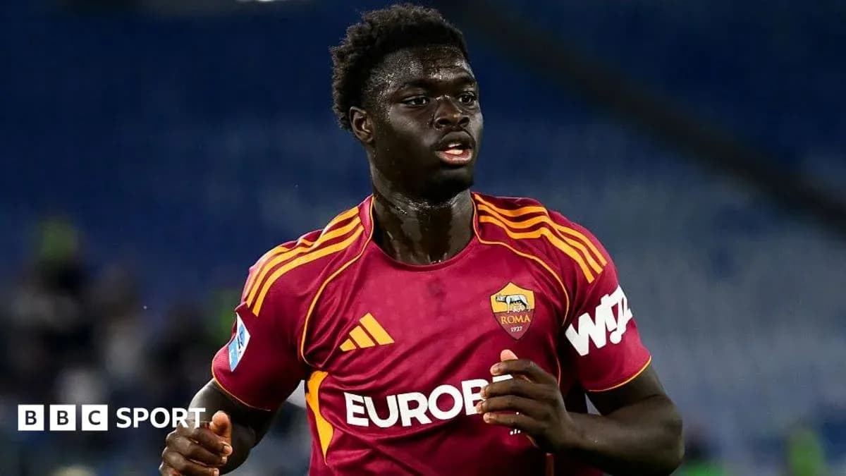 Player in AS Roma jersey running on the field