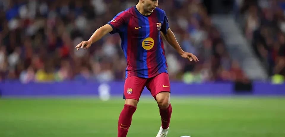 Player dribbling ball during match at stadium