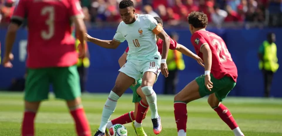 Player dribbling the ball during France vs Morocco match