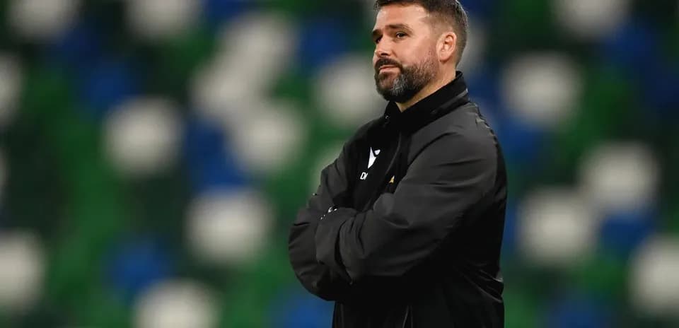 Coach observing the game from the sidelines