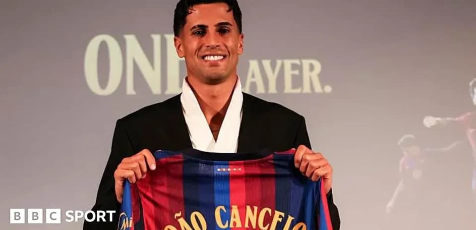 Player holding FC Barcelona jersey at presentation event