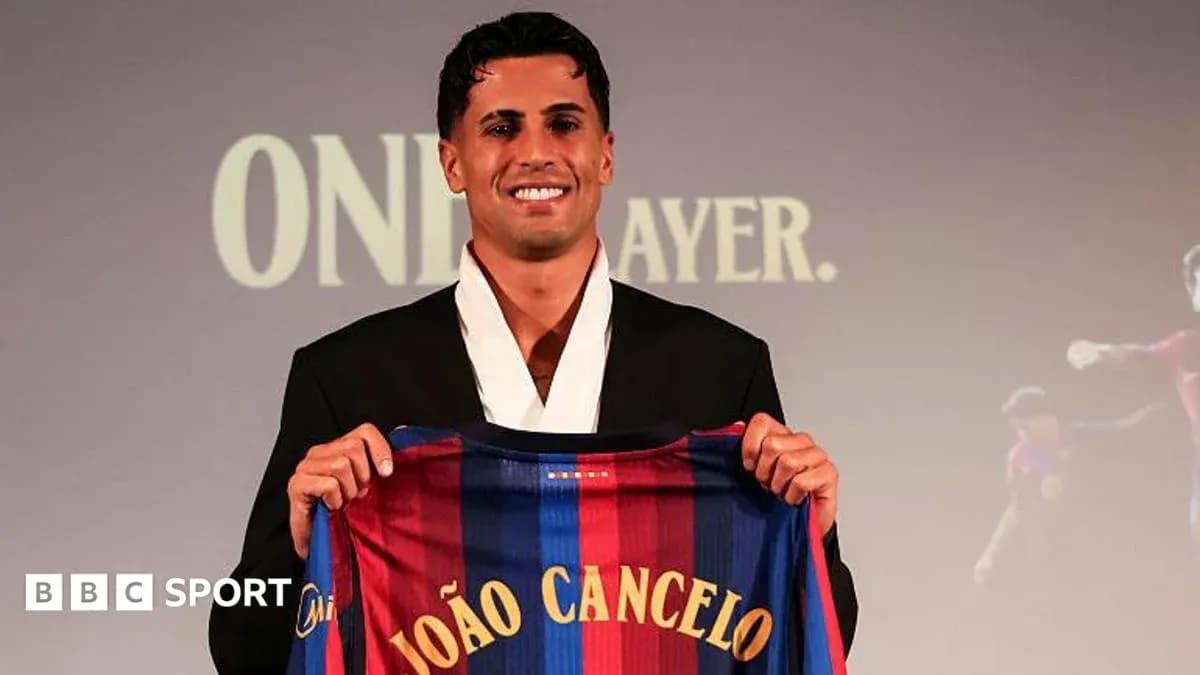 Player holding FC Barcelona jersey at presentation event