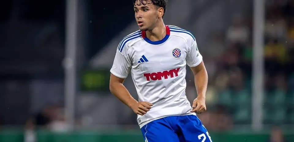 Player wearing white jersey running on the field