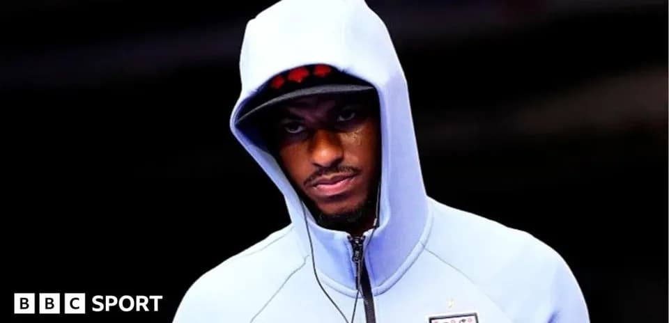 Player wearing hoodie before a match