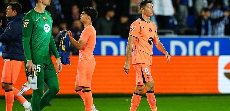 Barcelona players leaving the field after match