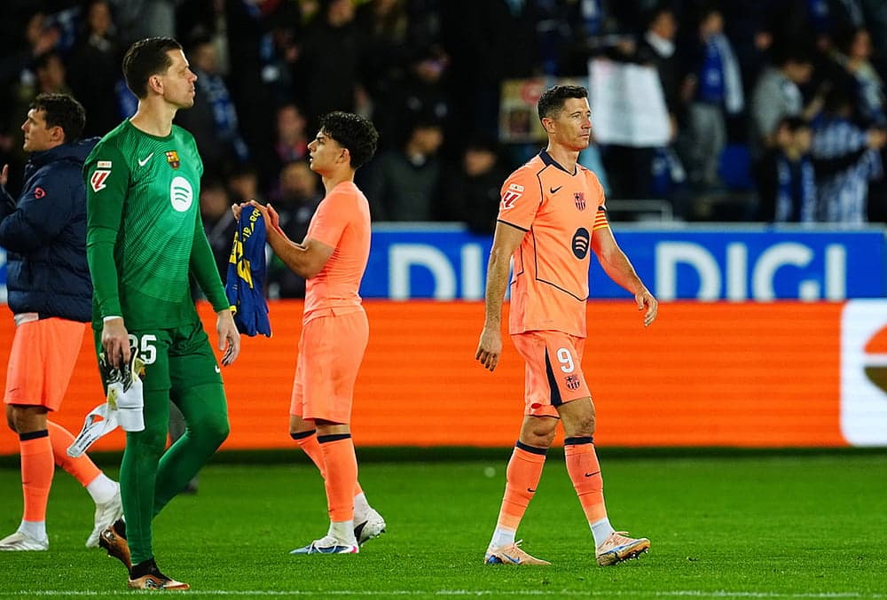 Barcelona players leaving the field after match