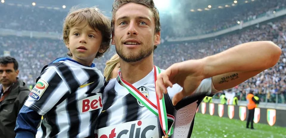 Player celebrating with child after match victory