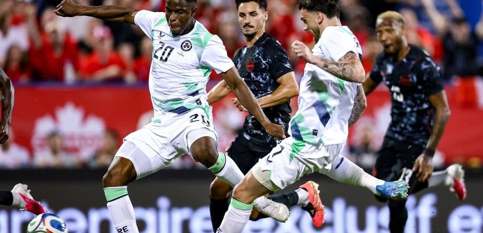 Players battling for the ball during a soccer match