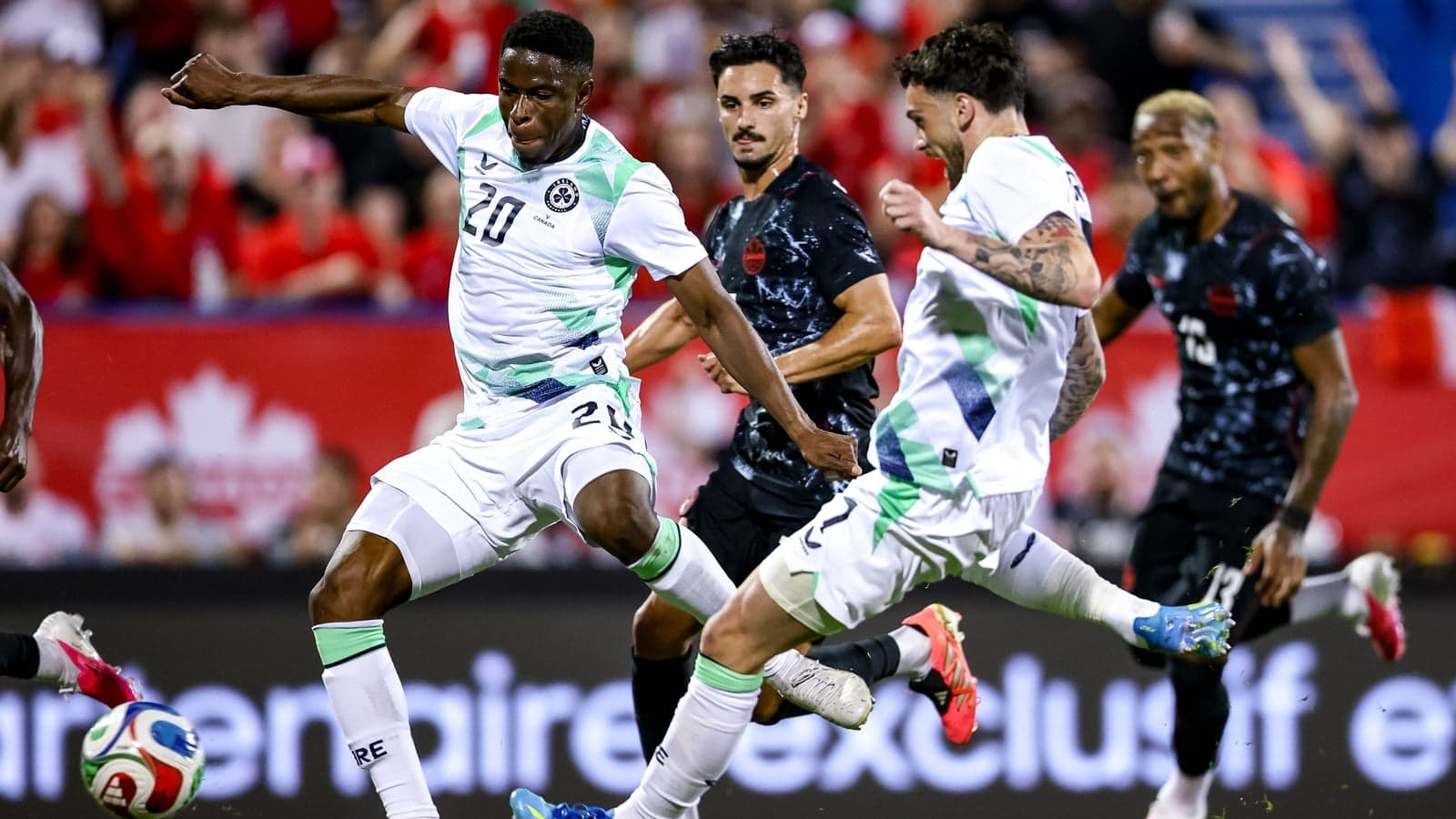 Players battling for the ball during a soccer match