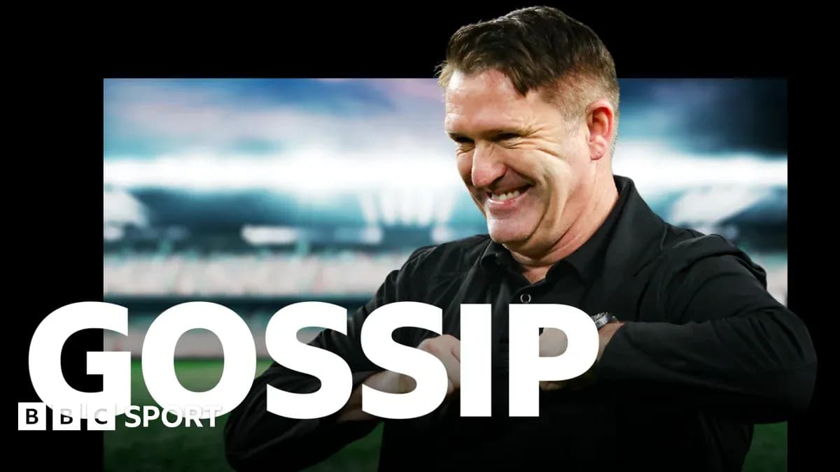 Football coach smiling with stadium in background