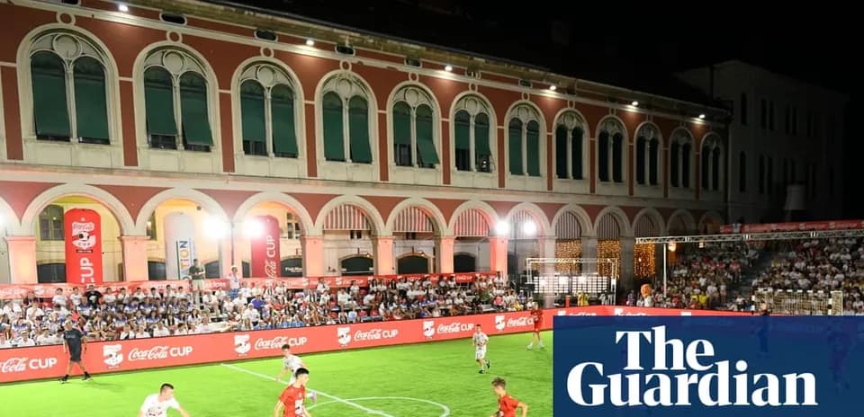 Players competing during Coca-Cola Cup match at night