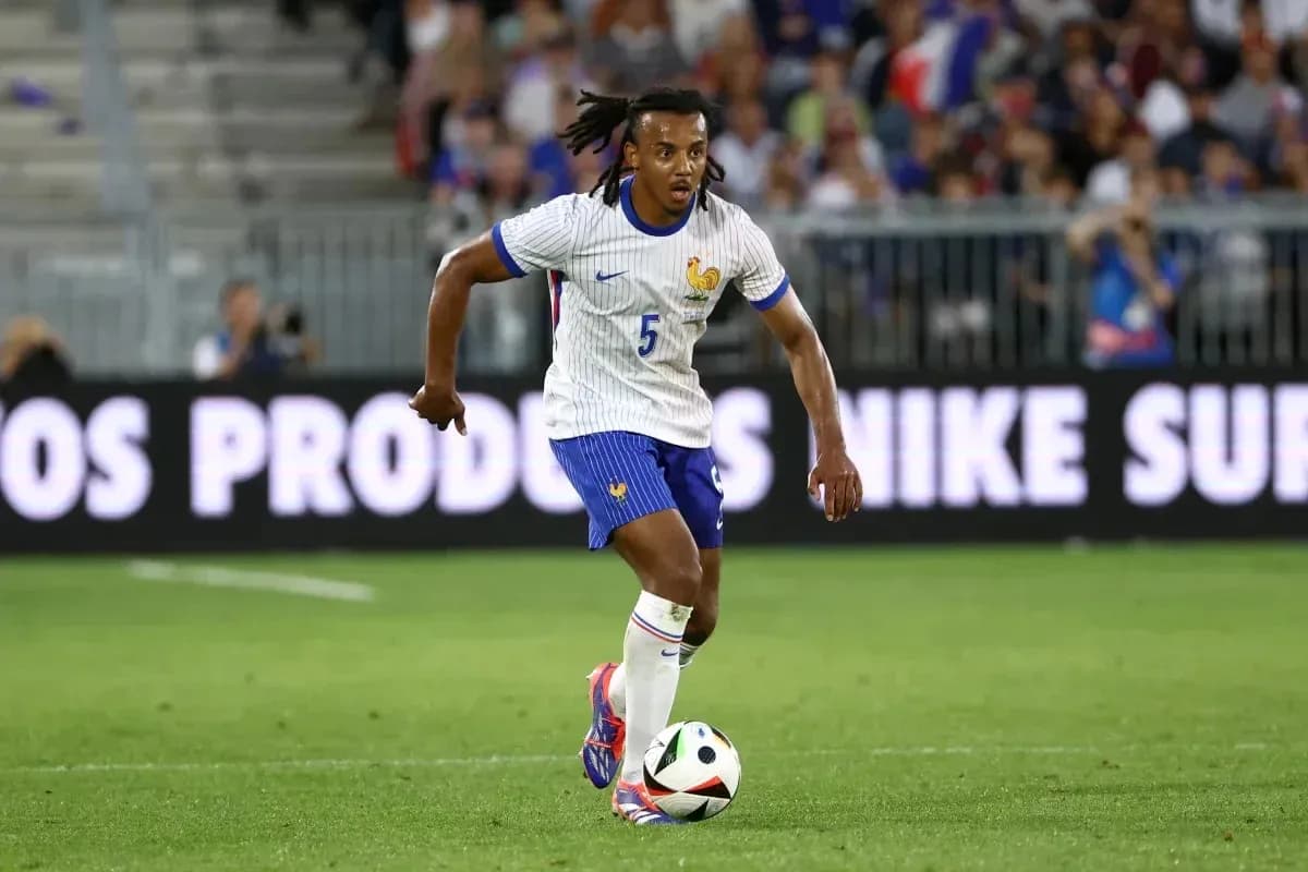 Player in France kit dribbling a soccer ball